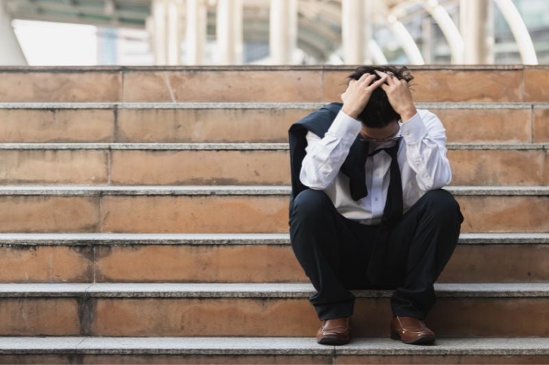 Stressed man on steps