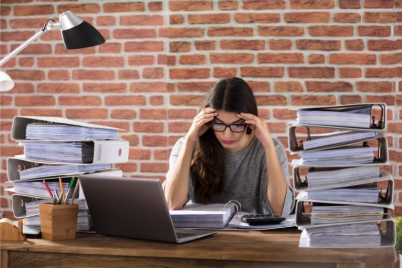 Woman stressed by paperwork