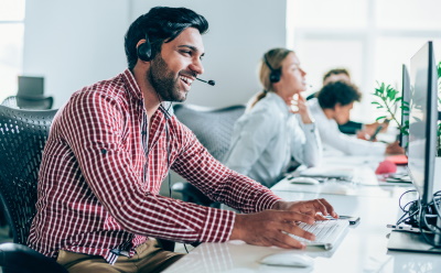 Man working at a helpdesk.