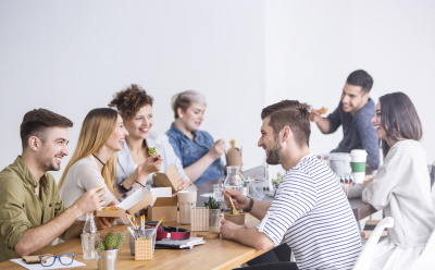 Coworkers enjoying an office lunch